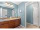 Bathroom featuring a double sink vanity, separate shower and blue walls at 8029 Acadia Estates Ct, Kissimmee, FL 34747