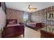 Themed bedroom with two beds, stylish decor and a ceiling fan at 8029 Acadia Estates Ct, Kissimmee, FL 34747
