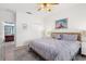 This bedroom includes a ceiling fan, hardwood floors and large closet space at 8029 Acadia Estates Ct, Kissimmee, FL 34747