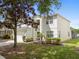 Beautiful two-story home featuring a well-manicured lawn and inviting curb appeal, with a screened in patio in the back at 8029 Acadia Estates Ct, Kissimmee, FL 34747