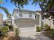 Lovely two-story home with a manicured front yard, two-car garage, and great curb appeal, nestled in a quiet neighborhood at 8029 Acadia Estates Ct, Kissimmee, FL 34747