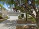 Charming two-story home with a two-car garage and well-maintained landscaping in a Gathering-friendly neighborhood at 8029 Acadia Estates Ct, Kissimmee, FL 34747