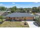 Inviting single-story home with large backyard and a spacious two-car garage with ample sunlight at 8720 Larwin Ln, Orlando, FL 32817