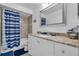 Updated bathroom with a granite countertop vanity and a shower-tub combination at 8720 Larwin Ln, Orlando, FL 32817