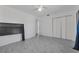 Empty bedroom featuring tile floors, closet, fan, and neutral paint at 8720 Larwin Ln, Orlando, FL 32817