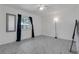 Bedroom with tile floors, fan, and a large window for natural light at 8720 Larwin Ln, Orlando, FL 32817