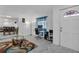 Bright entryway featuring neutral walls, tiled floors, and an adjacent dining area for seamless living at 8720 Larwin Ln, Orlando, FL 32817