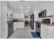 Bright kitchen featuring white cabinetry, granite countertops, and stainless steel appliances for a modern feel at 8720 Larwin Ln, Orlando, FL 32817