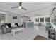 Spacious living room featuring a wet bar, tile floors, and plenty of natural light at 8720 Larwin Ln, Orlando, FL 32817