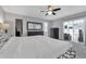 Bedroom featuring carpet, fan, dark furniture, and sliding glass doors at 8720 Larwin Ln, Orlando, FL 32817