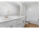 Bathroom featuring double sinks, a large mirror, and a shower-tub combination, enhanced by wood-look tile at 9687 Lost Creek Dr, Winter Garden, FL 34787