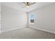 Bedroom showcasing neutral carpet and a window providing natural light and view at 9687 Lost Creek Dr, Winter Garden, FL 34787