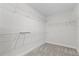 Walk-in closet boasts wire shelving creating an organized space for storage and clothing at 9687 Lost Creek Dr, Winter Garden, FL 34787