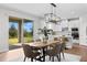 Open concept dining area featuring a view of the outdoors and leading into the kitchen at 9687 Lost Creek Dr, Winter Garden, FL 34787