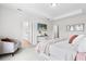 Serene main bedroom featuring a neutral color scheme, plush carpeting, and tray ceiling at 9687 Lost Creek Dr, Winter Garden, FL 34787