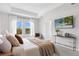 Comfortable main bedroom with natural lighting, neutral color palette, and a cozy seating area at 9687 Lost Creek Dr, Winter Garden, FL 34787