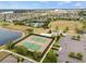 Community tennis courts with lake views and convenient parking at 9687 Lost Creek Dr, Winter Garden, FL 34787