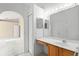 Bathroom featuring a vanity with wood cabinets, a large mirror, and a closet at 150 Golfside Cir, Sanford, FL 32773