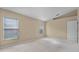 Bright bedroom with neutral walls, carpet floors, and windows letting in natural light at 150 Golfside Cir, Sanford, FL 32773