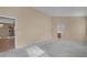 Spacious bedroom with neutral walls, carpet and hardwood floors, and an arched doorway at 150 Golfside Cir, Sanford, FL 32773