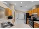 Bright kitchen with stainless steel appliances and plenty of cabinet space at 150 Golfside Cir, Sanford, FL 32773