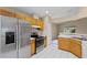 Well-lit kitchen boasts stainless steel appliances and a view of the backyard at 150 Golfside Cir, Sanford, FL 32773