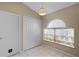 Laundry area featuring a window for natural light and ample closet space at 150 Golfside Cir, Sanford, FL 32773