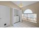 Dedicated laundry area with a washer, dryer, and a window for natural light at 150 Golfside Cir, Sanford, FL 32773