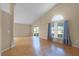 Spacious living room features vaulted ceilings, hardwood floors, and access to a screened-in lanai at 150 Golfside Cir, Sanford, FL 32773
