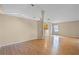 Expansive living room with hardwood floors open to kitchen and dining area at 150 Golfside Cir, Sanford, FL 32773