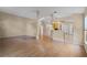 Open-concept living room with hardwood floors flows seamlessly to the kitchen at 150 Golfside Cir, Sanford, FL 32773