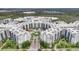 Stunning aerial view of a resort-style building complex, showcasing its spacious layout and serene waterfront location at 14501 Grove Resort Ave # 3222, Winter Garden, FL 34787
