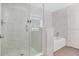 A modern bathroom featuring a glass-enclosed shower and a luxurious soaking tub for ultimate relaxation at 14501 Grove Resort Ave # 3222, Winter Garden, FL 34787
