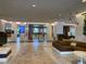 Spacious lobby area featuring comfortable seating, tiled floors, and ample lighting at 14501 Grove Resort Ave # 3222, Winter Garden, FL 34787