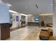 An inviting lobby with stylish seating, tiled floors, and a modern reception area at 14501 Grove Resort Ave # 3222, Winter Garden, FL 34787