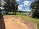 Expansive backyard featuring a serene lake view, perfect for outdoor relaxation and entertainment at 2815 Moonstone Bnd, Kissimmee, FL 34758