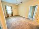 This bedroom features neutral walls, a light fixture, one window, and tan carpet at 2815 Moonstone Bnd, Kissimmee, FL 34758