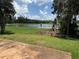 Scenic lake view framed by lush greenery, enhancing the property's natural charm and appeal at 2815 Moonstone Bnd, Kissimmee, FL 34758