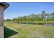 Expansive backyard with view of the water, perfect for relaxing and enjoying the tranquility of nature at 3218 Viceroy Ct, Poinciana, FL 34759
