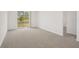 Bright bedroom with neutral carpet and sliding glass doors offering scenic views at 3218 Viceroy Ct, Poinciana, FL 34759