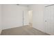 A bright bedroom features neutral walls, carpeting and closet doors at 3218 Viceroy Ct, Poinciana, FL 34759