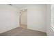 Neutral hallway and bedroom features carpet flooring and natural light at 3218 Viceroy Ct, Poinciana, FL 34759