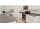 Well-appointed kitchen featuring stainless steel appliances and granite countertops, perfect for culinary enthusiasts at 3218 Viceroy Ct, Poinciana, FL 34759