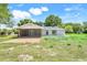 View of the backyard featuring a screened-in porch with a covered patio at 4570 Chambliss Rd, Winter Haven, FL 33884