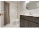 Traditional bathroom featuring a vanity, toilet and bathtub with a shower and curtain for privacy at 4570 Chambliss Rd, Winter Haven, FL 33884