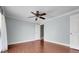 Spacious bedroom with a ceiling fan, hardwood floors and large windows providing lots of natural light at 4570 Chambliss Rd, Winter Haven, FL 33884