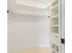 Walk-in closet boasting built-in shelving, drawers and a hanging rack for optimal storage at 4570 Chambliss Rd, Winter Haven, FL 33884