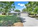 Well-maintained single-story home with a two car garage and manicured lawn at 4570 Chambliss Rd, Winter Haven, FL 33884