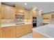 Bright kitchen featuring stainless steel appliances, custom cabinetry, and modern lighting at 4570 Chambliss Rd, Winter Haven, FL 33884