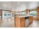 Kitchen breakfast bar with dishwasher and view into living area and backyard at 4570 Chambliss Rd, Winter Haven, FL 33884